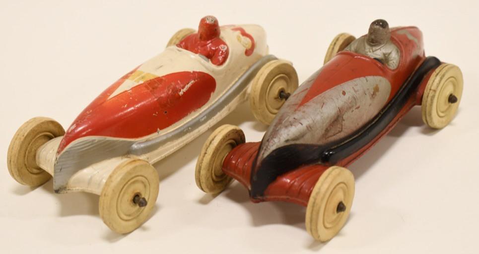 (2) Auburn Rubber Racer Cars: Lot of 2 Auburn Rubber racer cars with drivers. Both display nicely with some wear from play and age. Measures approximately 6 1/2" long.