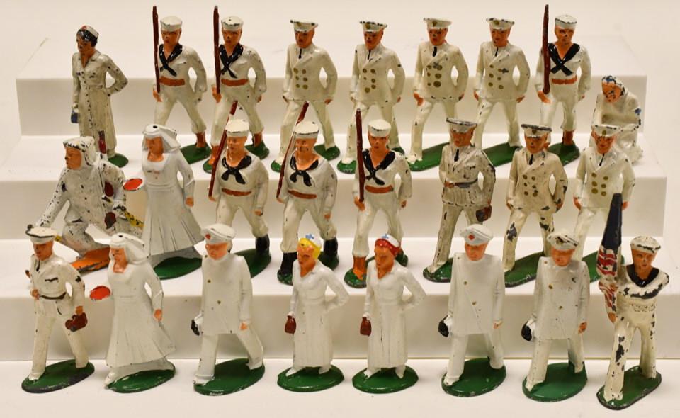 Lot of 22 Lead Barclay / Manoil Navy Sailors: Lot of 16 lead Barclay / Manoil Navy sailor soldiers. Includes a nurse, doctor, flag bearer, and more. Displays nicely with paint loss and wear from play and age. Largest measures approximately 4" tal