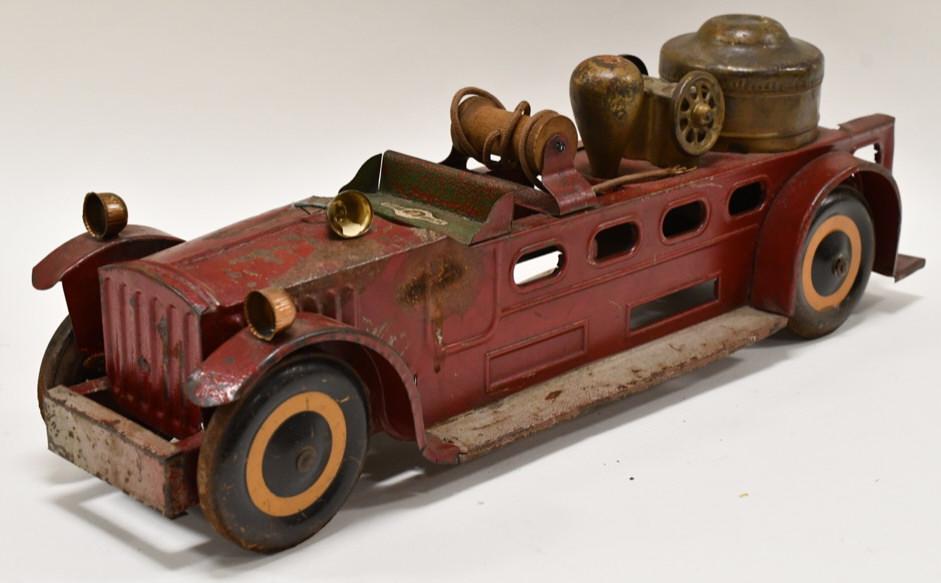 JC Penny Little Jim Fire Pumper Truck: JC Penny tin Little Jim fire pumper truck. Displays nicely with paint loss and wear from play and age. Measures approximately 19 1/2" long.