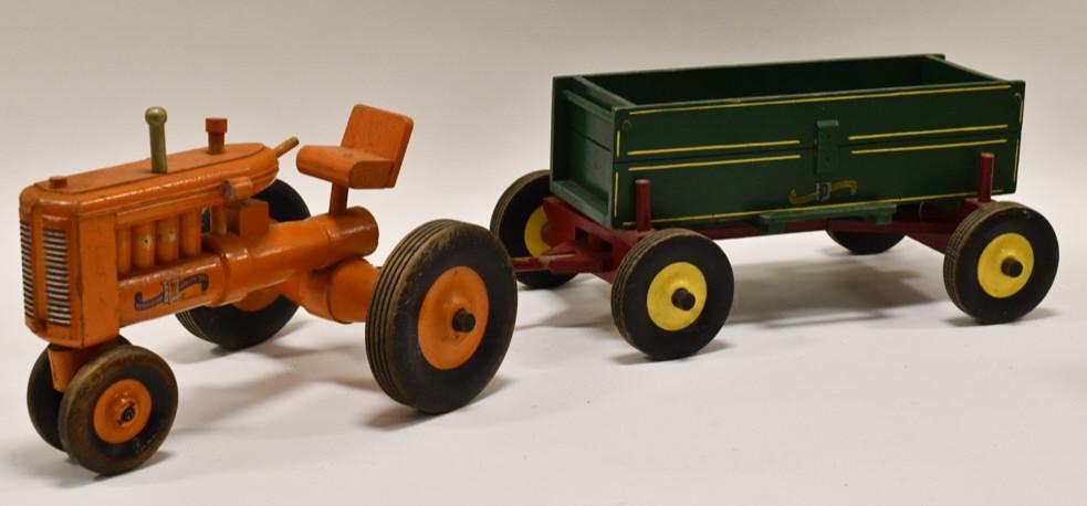 Peter Mar Wood Allis Chalmers Tractor with Wagon: Peter Mar wood toys Allis Chalmers tractor with wagon. The tractor is missing the steering wheel. Good condition with wear from play and age. Overall measures approximately 31" long.