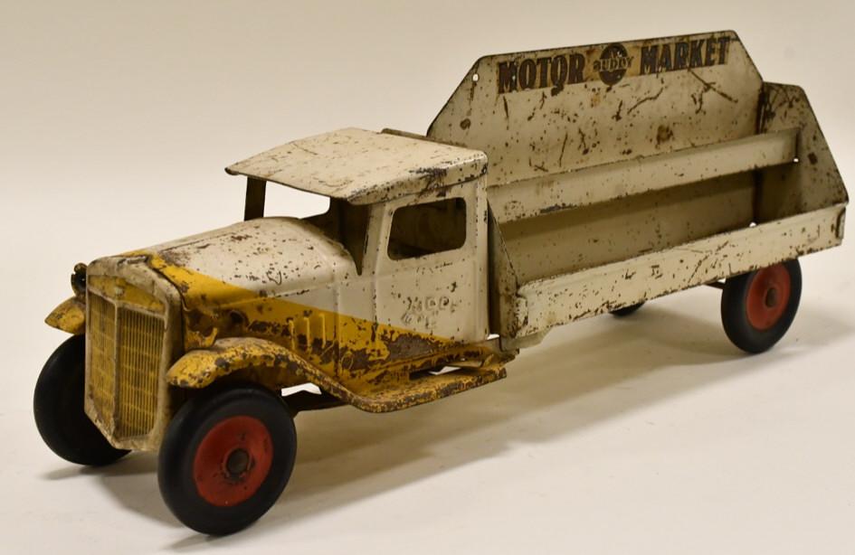 Original Buddy L Motor Market Delivery Truck: Original Buddy L motor marked delivery truck. Displays nicely with paint loss and wear from play and age. Measures approximately 20 1/2" long.