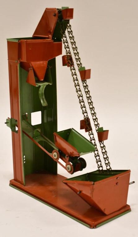 Wolverine Crank Action Sand Loader Conveyor: Wolverine crank action sand loader conveyor. Nice condition with some wear from play and age. The crank works. Displays nicely. Measures approximately 11" tall.