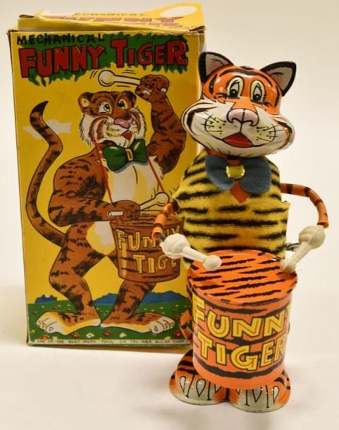 Marx Tin Windup Drumming Funny Tiger: Marx tin litho windup drumming funny tiger with the original box. The box has light wear and tear from age. The toy is in working order. Displays nicely with light wear. Measures approximately 8" tall