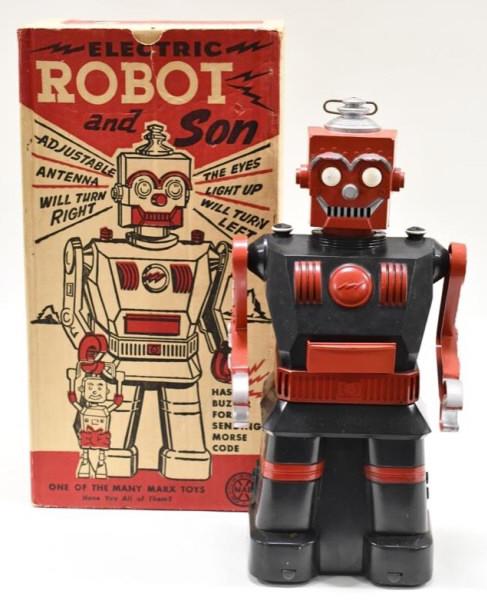 Marx Electric Battery Operated Robot and Son: Marx Electric battery operated robot. It is missing the smaller "son" robot. The box has a hole in it The robot is made of plastic. Displays nicely with wear from play and age. The robot is untested. 