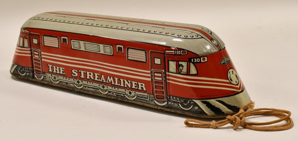 Wolverine "The Streamliner" Tin Pull Toy Train: Wolverine tin litho "The Streamliner" pull toy train. Displays nicely with light wear from play and age. The wheels are made of wood. Measures approximately 17 3/4" long.