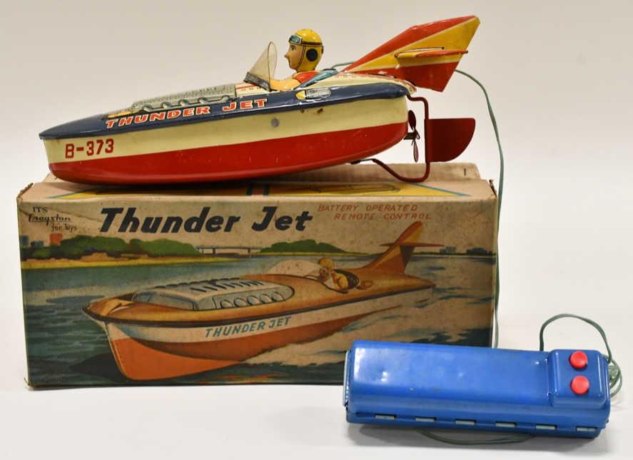 Cragstan Battery Op. Tin Litho Thunder Jet Boat: Cragstan Toys battery operated tin litho Thunder Jet boat in the original box. Displays nicely with some light wear from storage and display. Has some light surface rust from storage, but appears to h