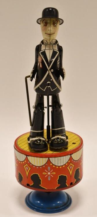 Japan S&E Tin Litho Windup Dancing Sam: Japan S&E tin litho windup Dancing Sam. Displays nicely with some paint loss and wear from play and age. Overall nice condition. The windup works. Measures approximately 8 1/2" tall.