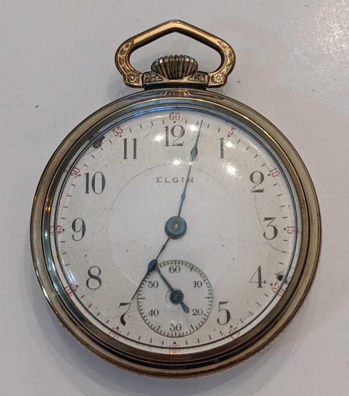 1910 Elgin 336 17 Jewel Open Face Pocket Watch: Nice running Elgin 17 Jewel Model 5 Grade 336 Open Face Pocket Watch. The 18 size pocket watch measures approx. 2-1/8" in diameter and has a Illinois 10k rolled gold filled case. The case has some wea