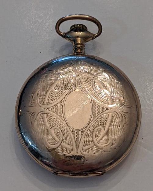 1913 Waltham 610 7 Jewel Hunting Case Pocket Watch: Nice running American Waltham 7 Jewel Model 1908 Grade 610 Hunting Case Pocket Watch. The 16 size pocket watch measures approx. 2" in diameter and has a Dueber 20 year case. The case has some wear. Th