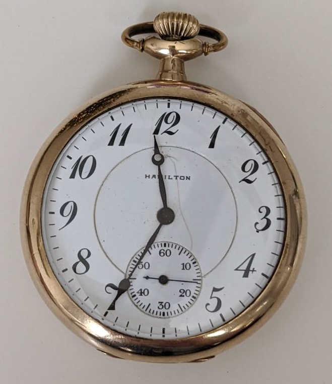 1919 Hamilton 956 17 Jewel Open Face Pocket Watch: Nice running Hamilton 17 Jewel Model 2 Grade 956 Open Face Pocket Watch. The 16 size pocket watch measures approx. 2" in diameter and has a Hamilton 25 year case. The case shows some light wear and th