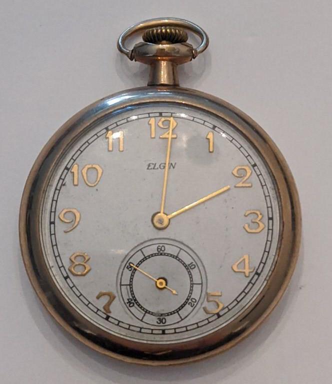 1923 Elgin 313 15 Jewel Open Face Pocket Watch: Nice running Elgin 15 Jewel Model 7 Grade 313 Open Face Pocket Watch. The 16 size pocket watch measures approx. 2" in diameter and has a Philadelphia 20 year case. The case shows some wear. The face i