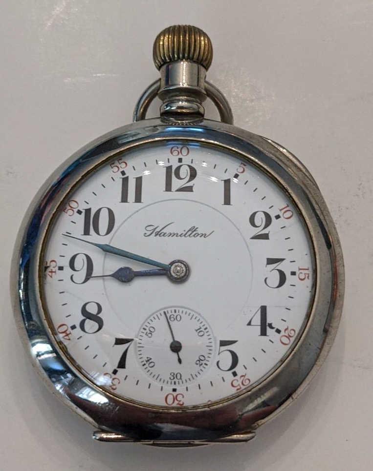 1905 Hamilton 940 21 Jewel Open Face Pocket Watch: Nice running Hamilton 21 Jewel Model 1 Grade 940 Open Face Pocket Watch. The 18 size railroad grade pocket watch measures approx. 2-1/8" in diameter and has a Dueber Silverine case. The case shows som