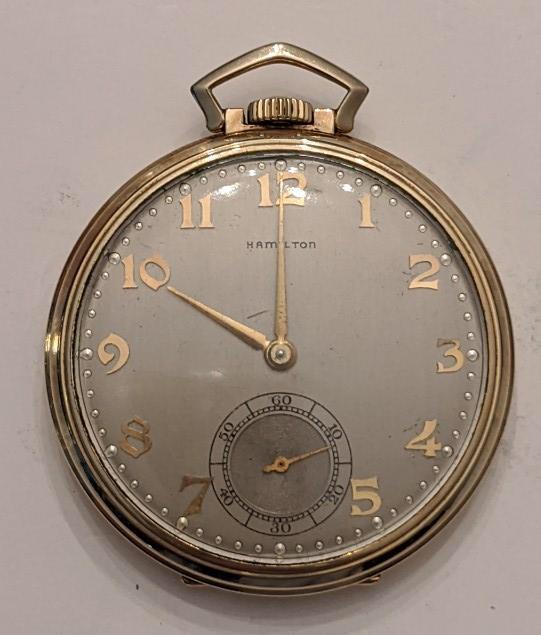 1947 Hamilton 923 23 Jewel Open Face Pocket Watch: Nice running Hamilton 23 Jewel Model 1 Grade 923 Open Face Pocket Watch. The 10 size pocket watch measures approx. 1-3/4" in diameter and has a Wadsworth 14k gold filled case. The case shows some ligh