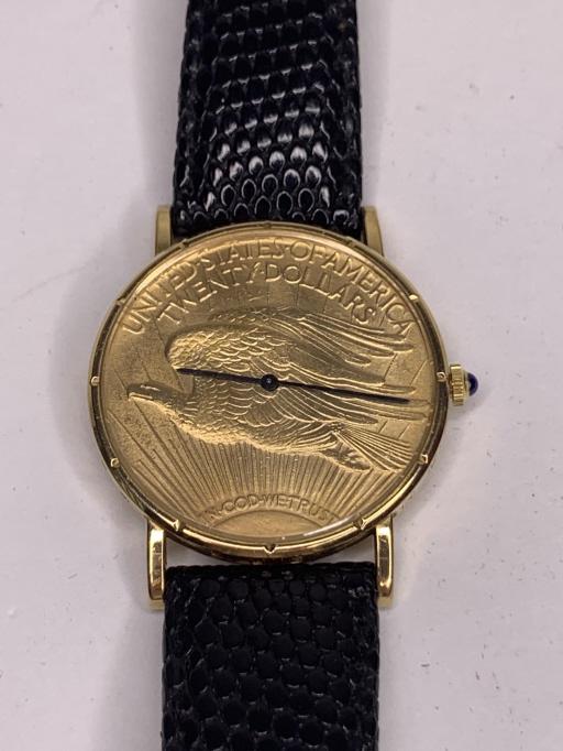 Corum 1928 $20 Gold St Gauden Wrist Watch: Rare Corum wrist watch created with a 1928 St Gauden $20 gold coin. Leather Debeer band. Includes original box. 18k gold case and 22k gold coin. According to seller this wach cost $25,000 new!