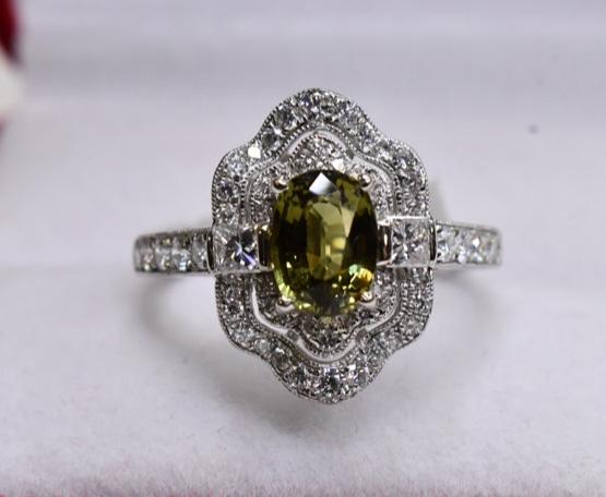 Platinum Alexandrite & Diamond Ring: Beautiful platinum genuine alexandrite and diamond ring accompanied by AIGL Appraisal and GIA Alexandrite report. The ring contains a 1.41 carat oval brilliant cut step cut alexandrite with a yellowis