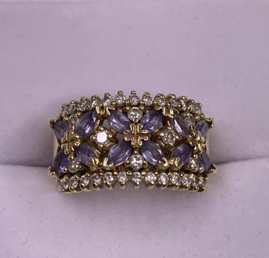 14k Yellow Gold, Diamond, and Tanzanite Ring: 14k Yellow Gold, Diamond, and Tanzanite Ring. Size: 6.5. Weighs: 7.21 grams