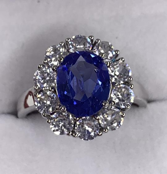 3.68ct Princess Diana Tanzanite Ring: Lab created stone. Silver tone ring. Size: 9