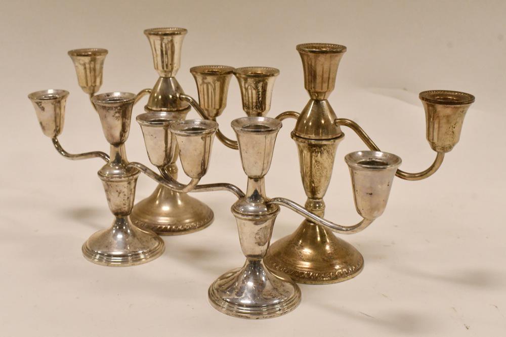 (4) Weighted Sterling Silver 3-Light Candelabras: (2) Nice condition matching pairs of weighted sterling silver 3-light candelabras. The candelabras measure 7-1/2" & 5-1/5" tall. Total weight 64.4 troy ounces.