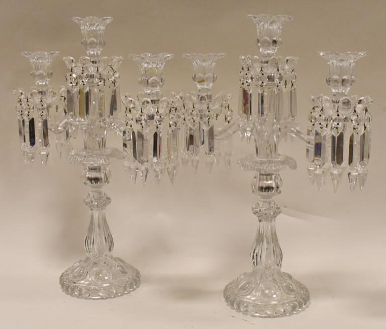 Pair Of Baccarat Medallion 3-Light Candelabras: Exquisite pair of Baccarat Crystal 3-Light Medallion Candelabras. The candelabras stand 17.5" tall x 12.5" wide. Baccarat acid mark on base. Retail for the pair is $11,000.