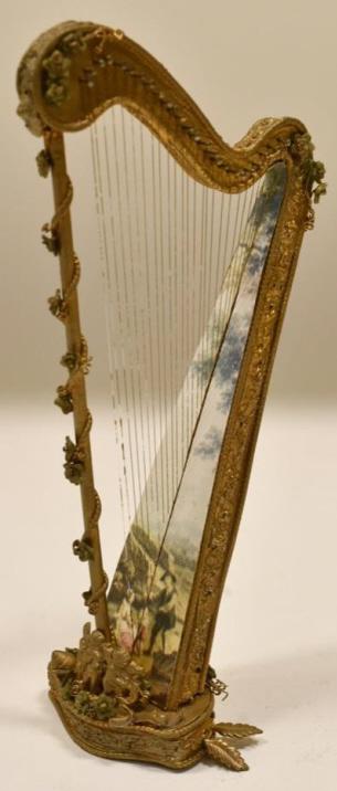 Dollhouse Miniature Cherub Harp By Sara Heritage: Beautiful miniature cherub harp by artisan Sara Elisabeth Heritage. Nice condition and signed on the base, has some gingerbread missing on the back. The harp measures 6.5" tall x 3" across.