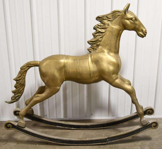 Large Unique Brass Rocking Horse: Outstanding large unique brass rocking horse. Nice condition with wear from display and age. Measures approximately 51" across by 45" tall. Weighs approximately 70 pounds