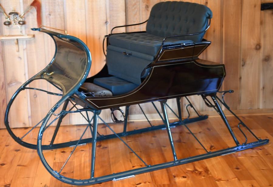 Restored Antique Oppenhiem Sleigh Beautifully: restored Antique Oppenheim horse drawn sleigh with unique flip out second row seating. Very nice condition with light wear from display. Displays extremely well with pin striping . Measures approximat
