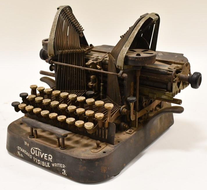 Antique Oliver No. 3 Typewriter: Hard to find Oliver No. 3 Standard Visible Writer. The typewriter was made in the very early 1900's. Overall measure 13-1/2" across x 10" tall x 14" deep. Needs a cleaning.