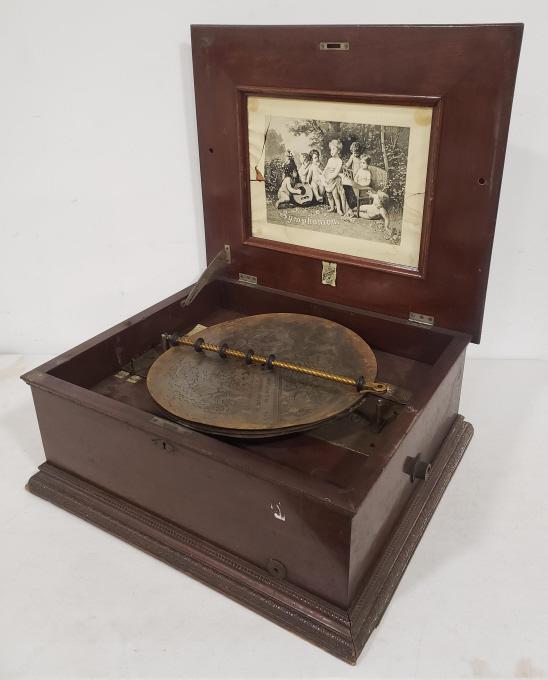 Antique Symphonion No. 3 Table Top Music Box: Antique Symphonion no. 3 table top music box. Includes (3) 14-7/8 discs. The box has a crack on the top and is missing the crank. Displays well with wear from use and age. Measures approximately 23-1/
