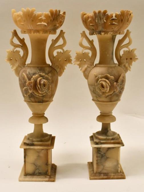 Pair Of Late 19th Century Carved Alabaster Vases: Nice pair of late 19th century carved alabaster vases. The vases have a carved leaf and rose design. The condition is nice with a few small edge dings, one handle is loose and needs to be repaired and
