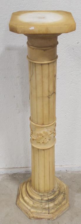 Late 19th Century Alabaster Pedestal: Nice Victorian alabaster carved pedestal. Features a leaf design. Has some cracks. Measures 40.75" tall with the wood base x 11.5" across.