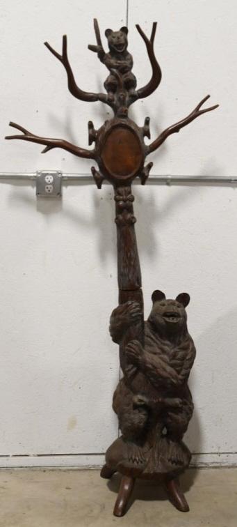 Vintage Black Forest Bear Hall Tree: Vintage hand carved Black Forest bear hall tree. Good condition with wear from use and age. Missing mirror and a branch. Still displays very well. Measures approximately 75" tall by 33" across.