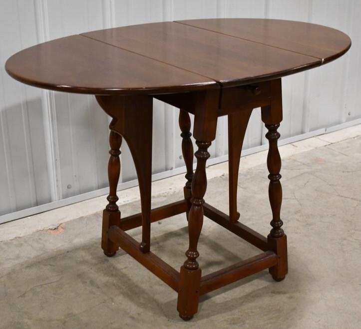 Stickley Cherry Drop Leaf Occasional Table: Stickley cherry drop leaf occasional table. Has an Early American design and is in nice used condition. Marked on bottom. Measures 25" tall x 36.25" across x 24.25 " deep fully extended.