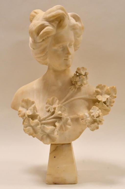 Large 19th Century Alabaster Young Woman Bust: Beautiful late 19th century alabaster bust featuring a young woman with flowers. The bust is in nice condition with some small edge chips. Measures 23.5" tall x 14.5" across.