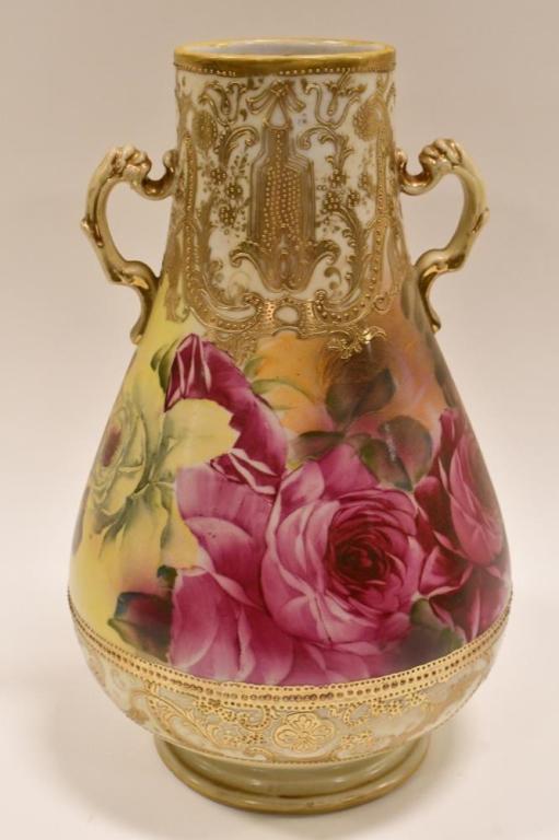 Large Unmarked Nippon Hand-Painted Vase: Beautiful unmarked large heavy gold detailed hand-painted two-handled Nippon vase. The vase is in nice condition and features roses. Measures 12.25" tall x 8" across.
