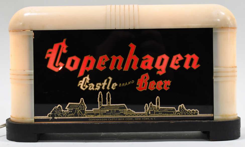 Art Deco Copenhagen Castle Beer Lighted Glass Sign: Scarce early Art Deco style reverse on glass Copenhagen Castle Brand Beer lighted advertising sign. Sign is in good condition with some wear from use and age. Face does have some minor touchups, and h