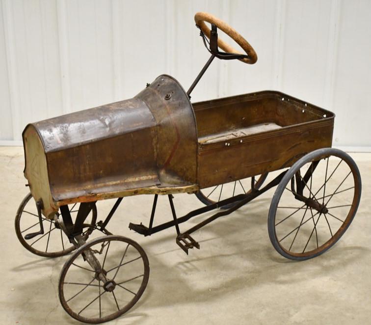 Early American National #4 Racer Pedal Car: Early American National #4 racer pedal car. Nice original condition with wear from play and age. Displays well with spoked wheels, hand crank, and wooden steering wheel. Measures approximately 38" lon
