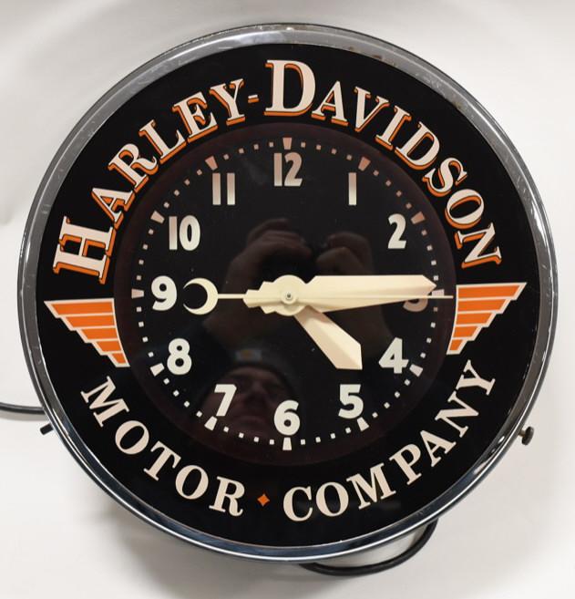 Harley-Davidson Motor Co. Neon Advertising Clock: Unique Glo-Dial style Harley-Davidson Motor Company fantasy neon advertising clock. Clock is in nice working condiiton with some wear from use. Displays well with outer glass. Measures approximately 1