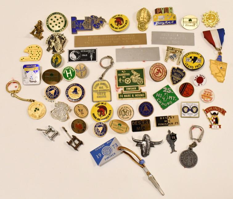 Lot Of Vintage 1960s / 70s Motorcycle Club Pins: Lot of 50 vintage 1960s and 1970s Motorcycle Club pins andmore. Lot includes enameled pins and more. They display very well with great colors and designs. Largest piece measures approximately 5" acros