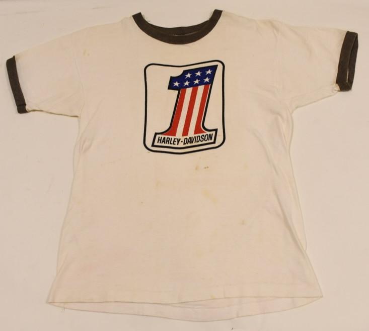 1970s Harley-Davidson Champion Blue Bar Shirt: Hard to find original 1970s Harley-Davidson shirt by Champion. Shirt is in good condition with discoloration, some staining, and wear from use and age. Displays extremely well. Has 1970s blue bar cham