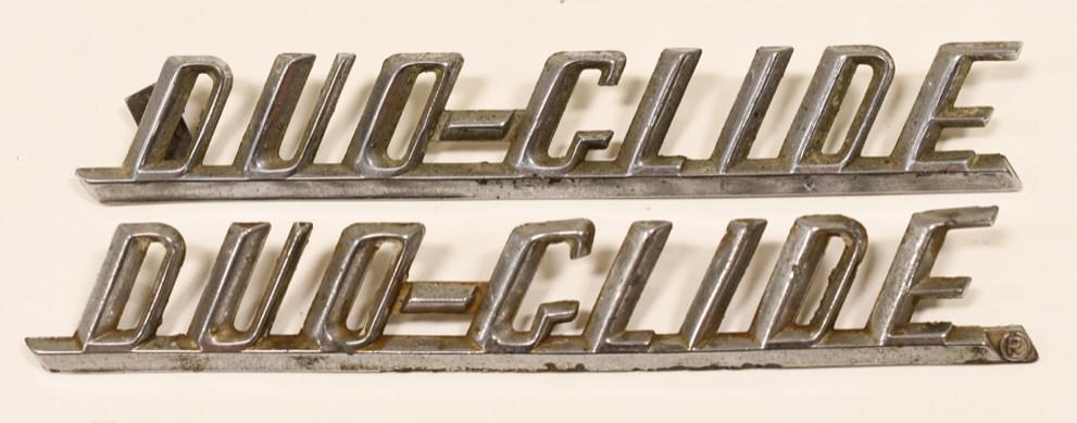 Harley-Davidson Duo-Glide Front Fender Badges: Lot of two Harley-Davidson Duo-Glide front fender emblem badges. Both are in fair condition with chrome loss and wear. One badge has one mounting peg that is shortened. Marked " 59195-58".