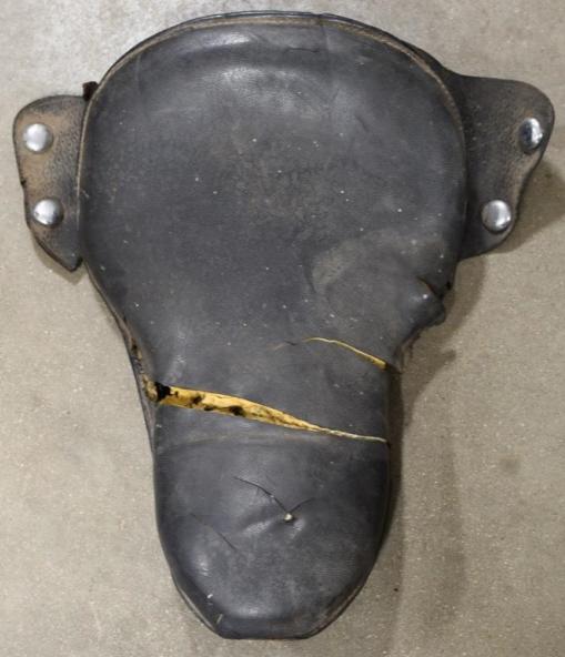 Harley-Davidson Knucklehead Flathead Buddy Seat: Harley-Davidson Knucklehead / Flathead buddy seat. Fair condition with damage wear from use and age. Still displays well with skirt. Measures approximately 23'" long by 16" across.