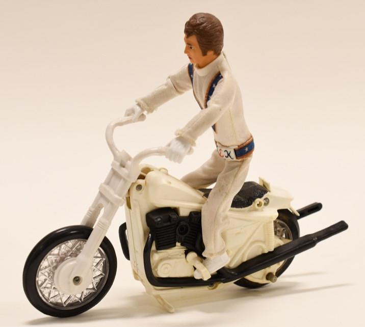 1972 Ideal Evel Knievel Stunt Cycle: 1972 Ideal Toys Evel Knievel motorcycle Stunt Cycle toy. Good condition with discoloration adn wear from use and age. Measures approximately 9" across.