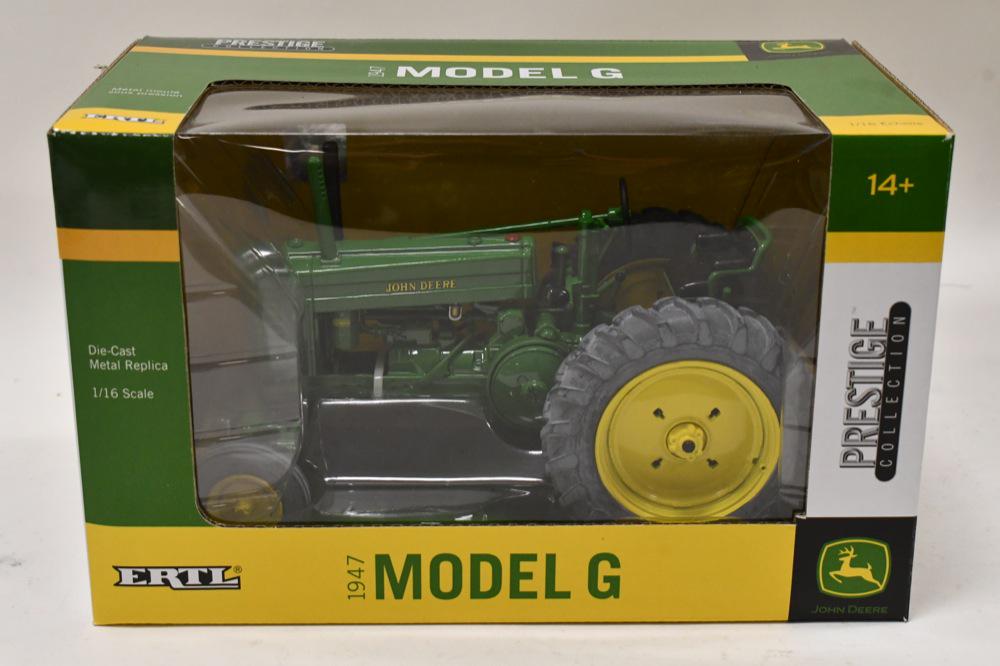 1/16 Ertl John Deere Model G Prestige Collection: 1/32 scale Ertl John Deere Model G prestige collection tractor. Nice condition in the box. Tires have some oxidation.
