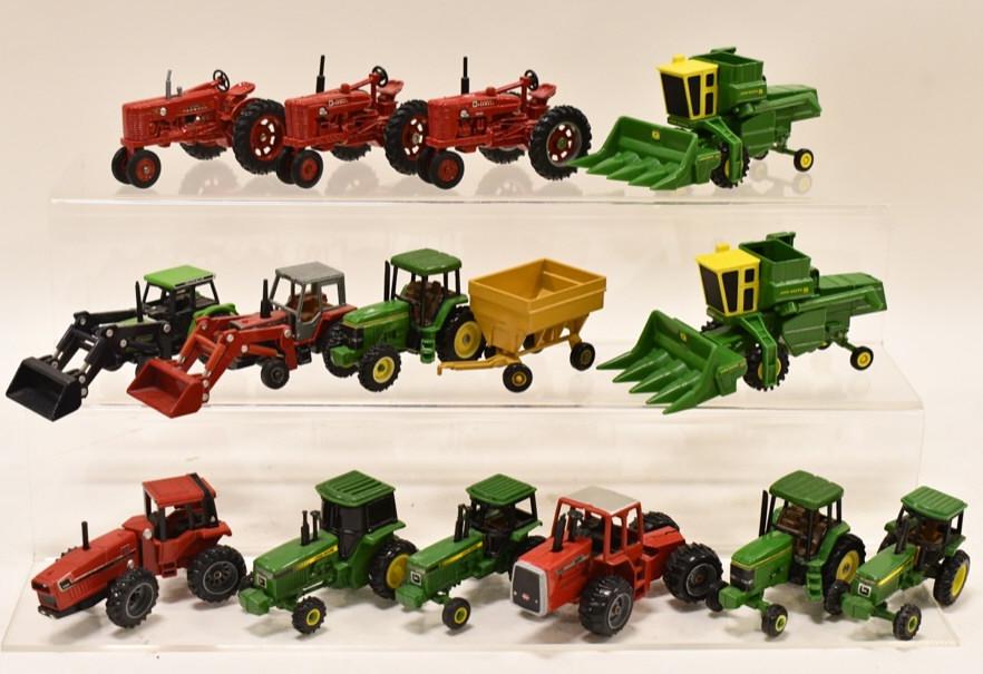 Lot Of Loose 1/64 & 1/43 Tractors & Combines: Lot of loose 1/64 and 1/43 scale tractors, combines, and wagon. Includes John Deere, Farmall, MF, and more. Nice condition with wear from storage and display. Comes with hard carry case.