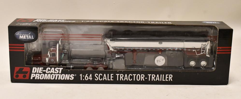 1/64 DCP Pete 379 w MAC Half Round Dump Trailer: 1/64 DCP Peterbilt 379 with MAC half round dump trailer. Nice condition in the box. Item no. 32597.