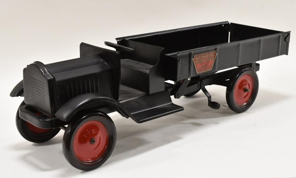 Restored Keystone Packard Dump Truck: Restored Keystone Packard dump truck. Displays nicely with an older restoration. The dump mechanism works. Nice condition with some wear from storage and display. Measures approximately 26" long.