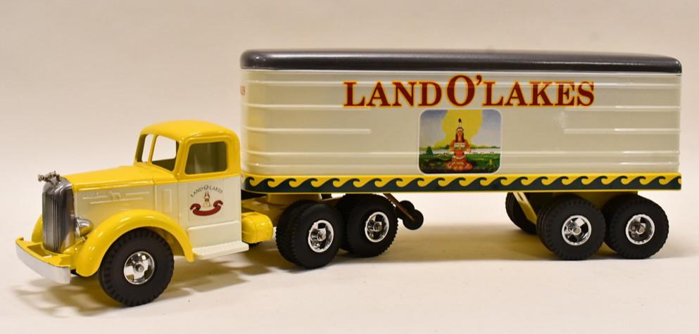 Custom Smith Miller Land O' Lakes Semi Truck: Custom Smith Miller Land O' Lakes Semi Truck & Trailer. Displays very well with a couple paint chips on the bumper. Measures approximately 30" long overall.