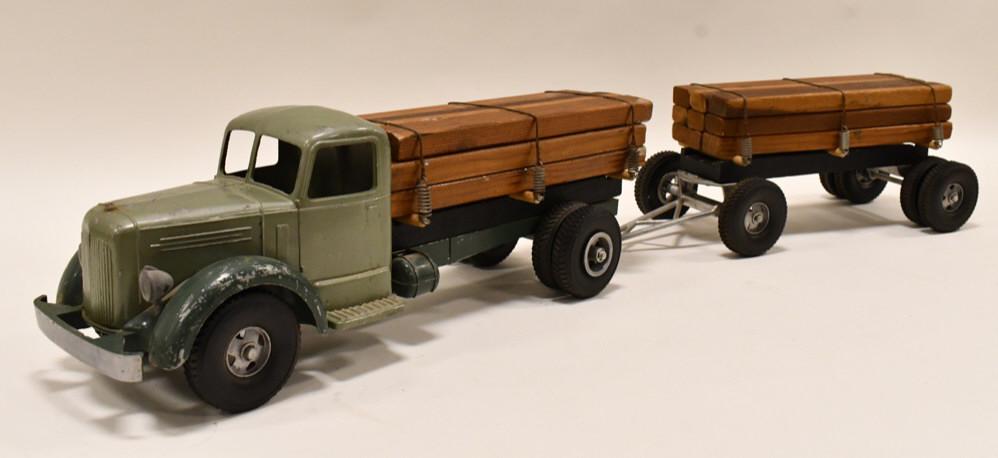 Smith Miller L Mack Lumber Truck w/ Pup Trailer: Smith Miller L Mack lumber truck with pup trailer. Displays nicely with a load of logs on both the truck and trailer. Good condition with wear from play and age. The truck is missing the hitch. Overal