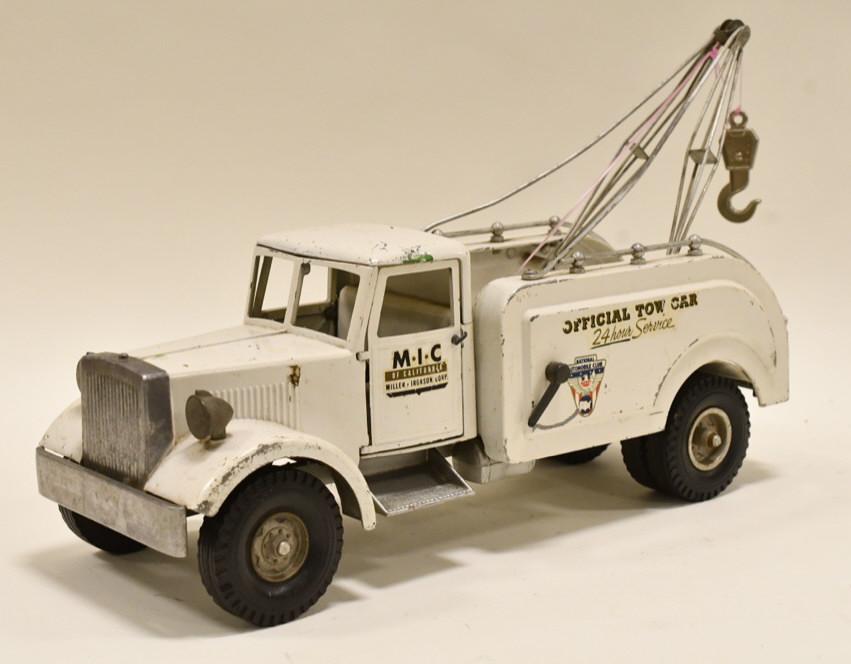 Smith Miller MIC 24 Hour Service Tow Truck Wrecker: Smith Miller M.I.C. 24 hour service tow truck wrecker. Has paint loss and wear from play and age. The winch cable and tow hook are not original. Measures approximately 17" long.