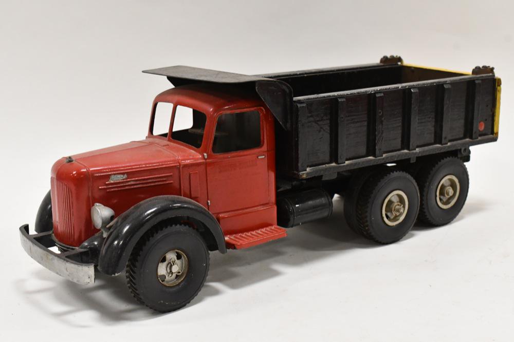 Custom Smith Miller L Mack Dump Truck: Custom Smith Miller L Mack dump truck. It is missing the Mack hood ornament and the hydraulic cylinder. Measures approximately 19" long.